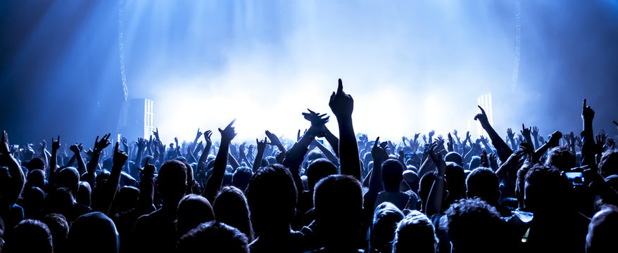 Youth nightlife crowd and concert-style atmosphere behind the state ID card collection